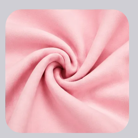 Four feature callout panels on a white background showing a light pink garment detail: classic crew neck, adjustable drawstring waist, cargo pocket, and soft breathable fabric. Text labels describe each feature.